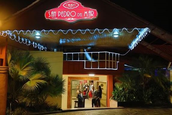 entrance with sign and lights at dusk