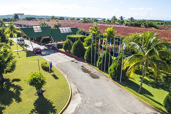aerial view of the hotel entrance with greenery