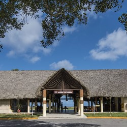 facade of the open lobby with guano roof