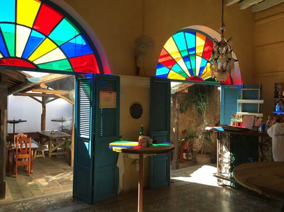 wooden tables and colorful stained glass 