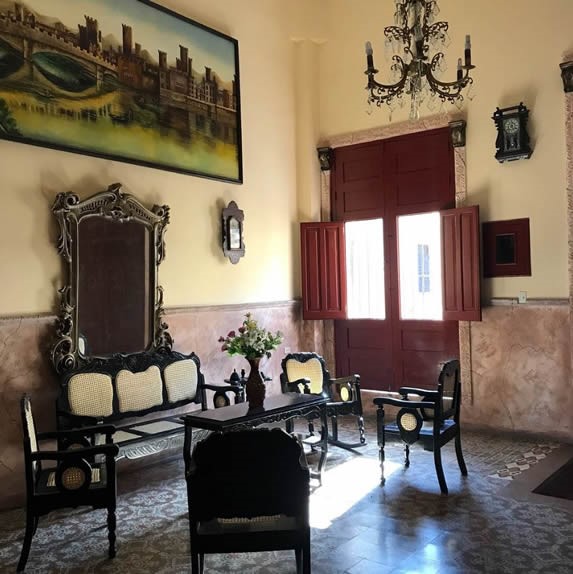 living room with marble walls and wooden furniture