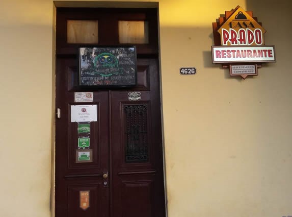 entrance with old wooden door and sign