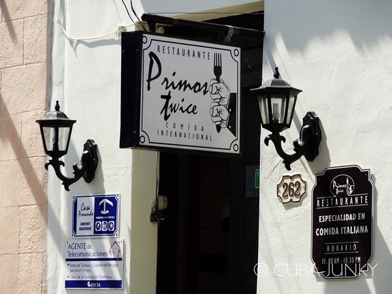 entrance with poster and colonial lanterns