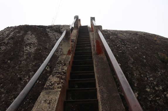 stone stairs with wooden railing