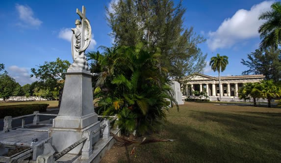 marble sculpture surrounded by greenery