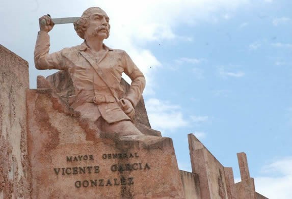 statue of Vicente García under the blue sky
