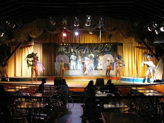 dancers on stage under the lights