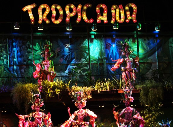 Dancers with colorful outfits on stage.