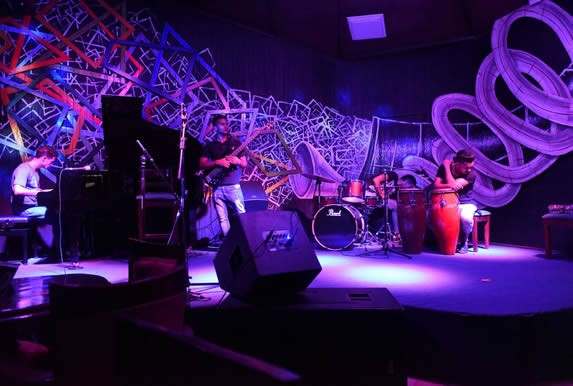musicians on the illuminated stage