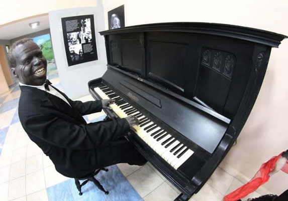 wax figure playing piano