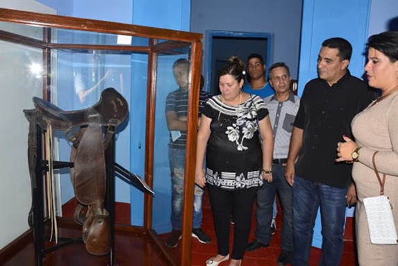 visitors looking at objects on display