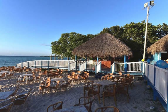 ranch by the sea with furniture on the sand