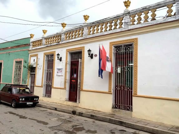 colonial restaurant facade with poster