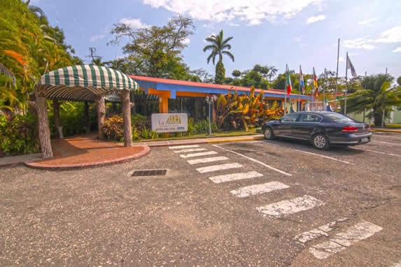 hotel parking surrounded by greenery