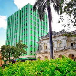 hotel facade surrounded by greenery 