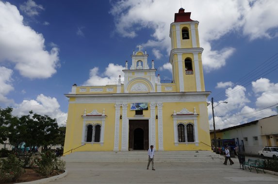 colonial facade of the church with bell tower