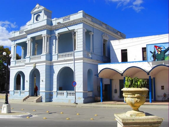 blue colonial building with balconies