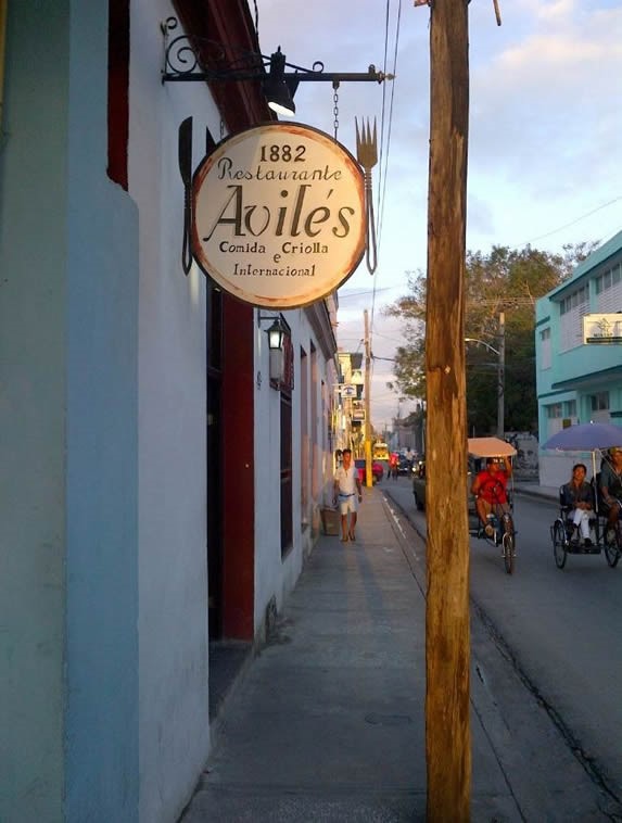 restaurant facade with hanging sign