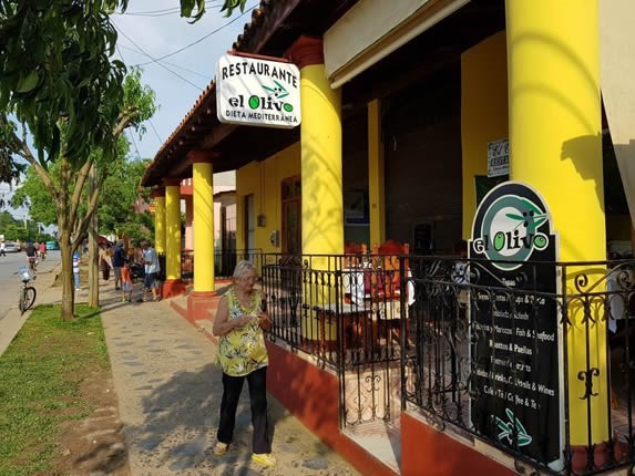 yellow facade with restaurant sign