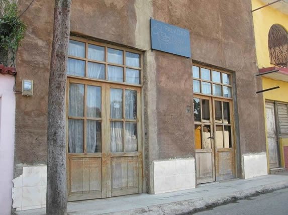 Facade of the restaurant with wooden doors.