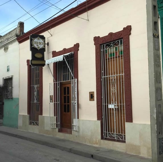 colonial building facade with hanging sign