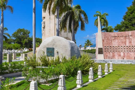 stone burial surrounded by greenery