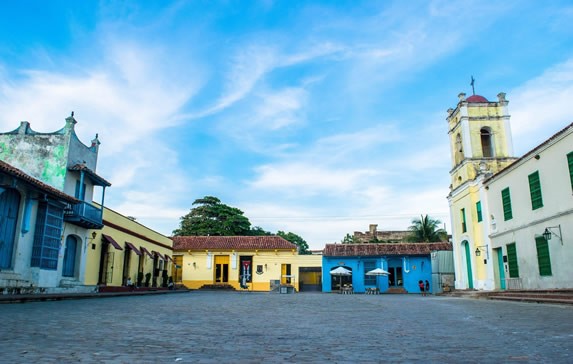 deserted square surrounded by colonial buildings