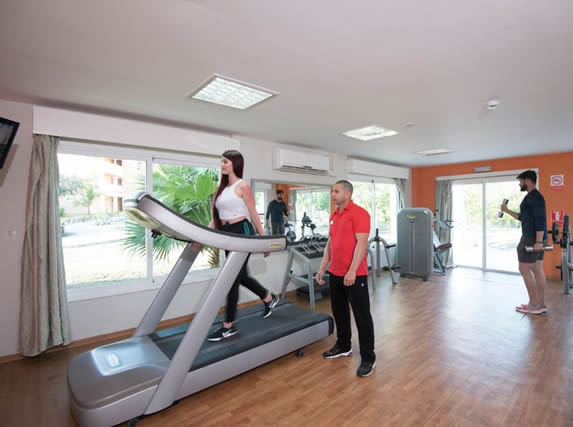 tourist exercising on gym treadmill