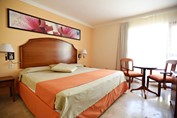 Wooden bed in hotel room