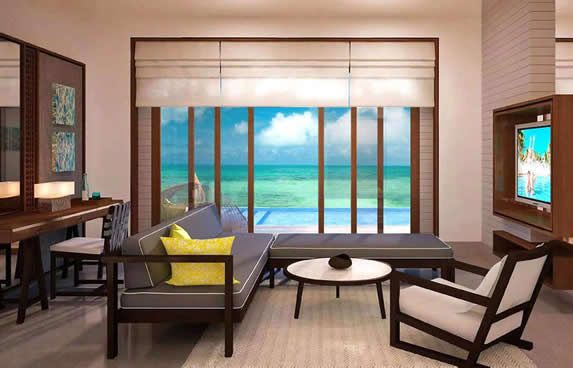 living room with windows and ocean view