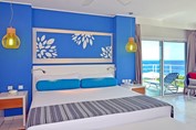 one bed room with balcony and sea view