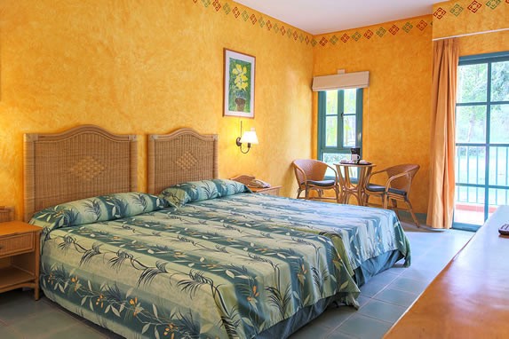 two-bed room with wooden furniture