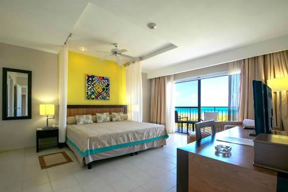 one bed room with balcony and sea view