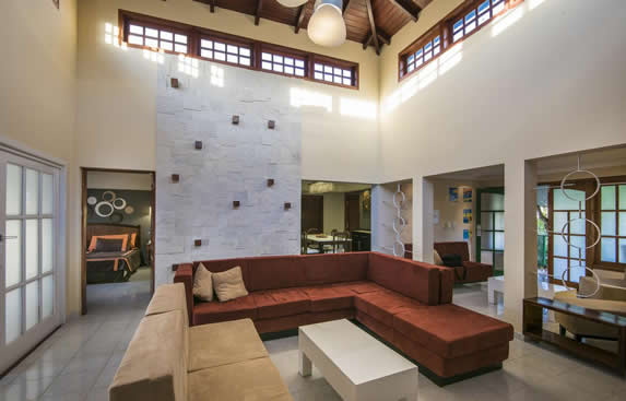 living room with sofa and wooden ceiling