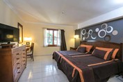 two-bed room with wooden furniture