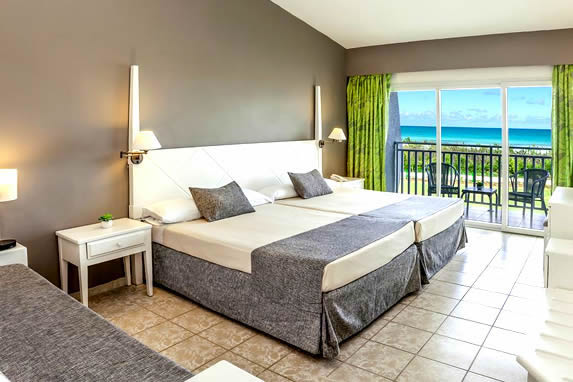 one bed room with balcony and sea view