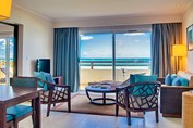 living room with balcony and ocean view