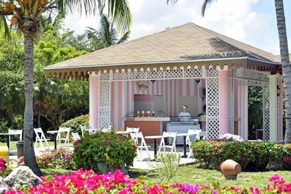 pink ice cream parlor surrounded by greenery