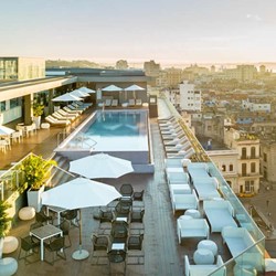 Aerial view of the roof, where the pool and a bar 