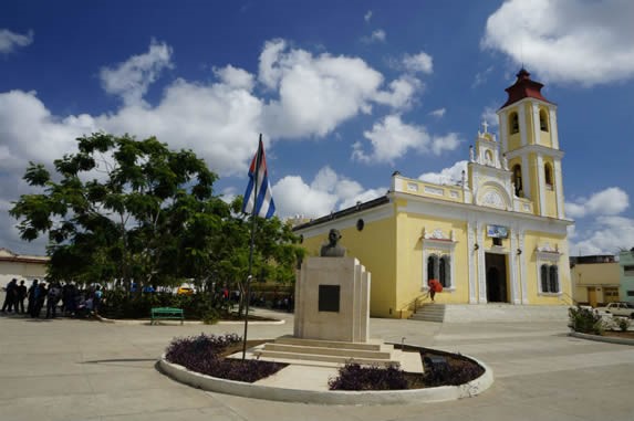 plaza with yellow colonial church