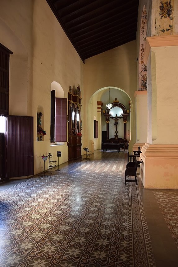 hallway with windows and wooden furniture