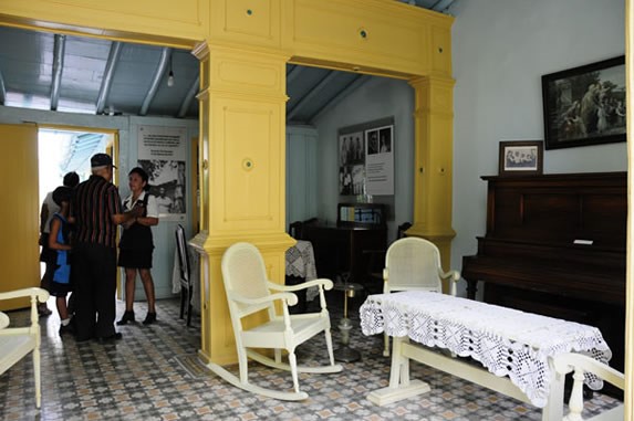 antique furniture and photographs on display