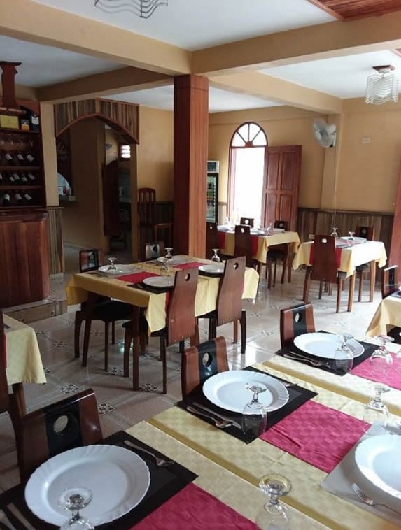 interior with wooden furniture and tablecloths