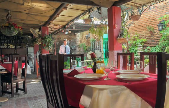 wooden furniture on the roofed patio