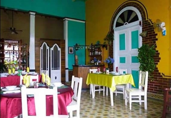 interior with white furniture and tablecloths