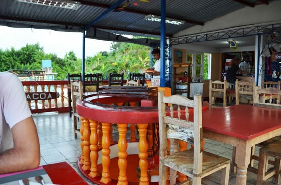 covered terrace with wooden furniture