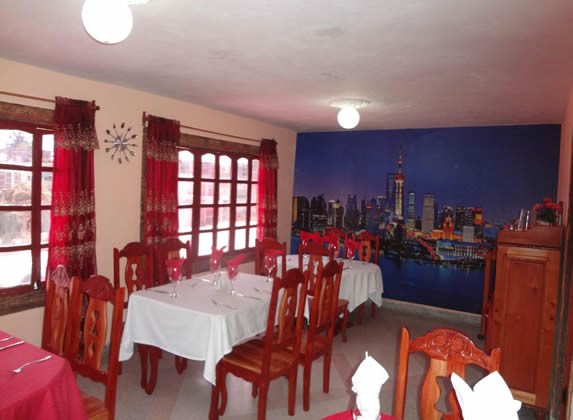 interior with wooden furniture and table linen