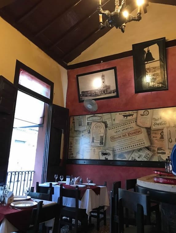 restaurant interior decorated with paintings
