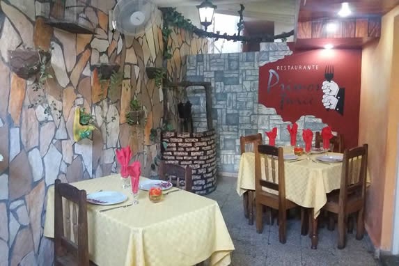 wooden tables with tablecloths and decorative well