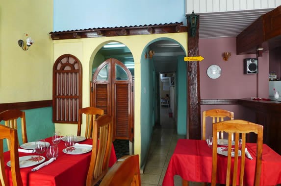 wooden tables with red tablecloths inside